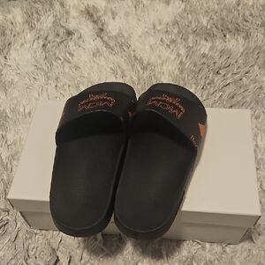 MCM Black Slides with Vibrant Orange Details